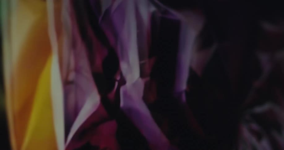 A camera spins over a rainbowcolored textured object