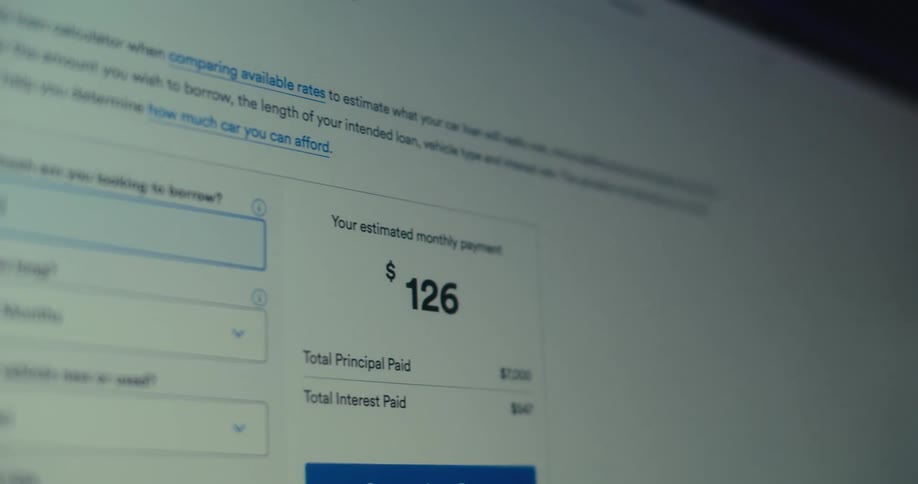 A closeup view of a digital mortgage calculator interface displays fields for home price down payment loan term and interest rate