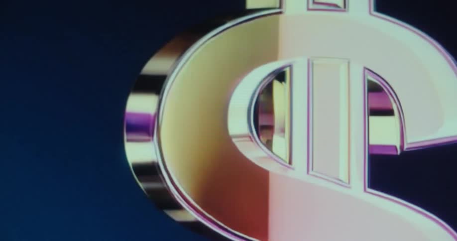 A metallic computer animated multidimensional dollar sign flashes and spins on a screen