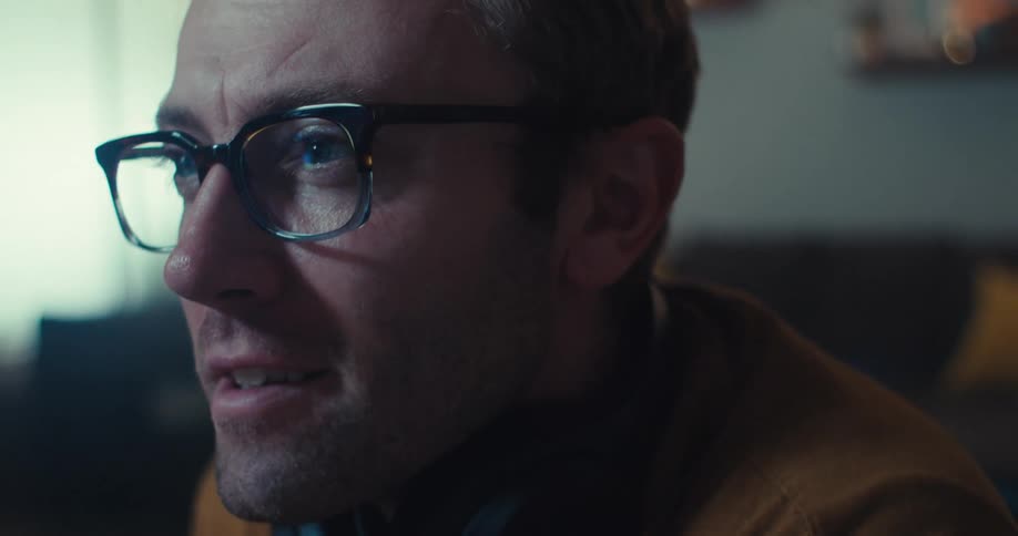 A man looking anxious then relieved and happy