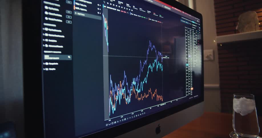 A person analyzing a stock market chart to make a trade