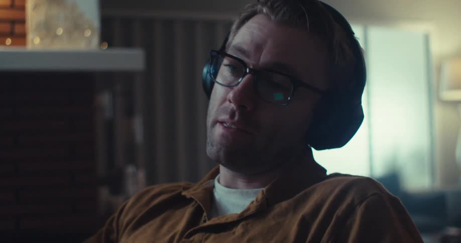 A man sits in a chair and talks