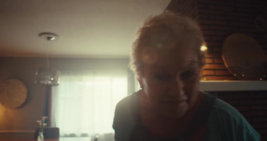 A woman is dancing by herself at home