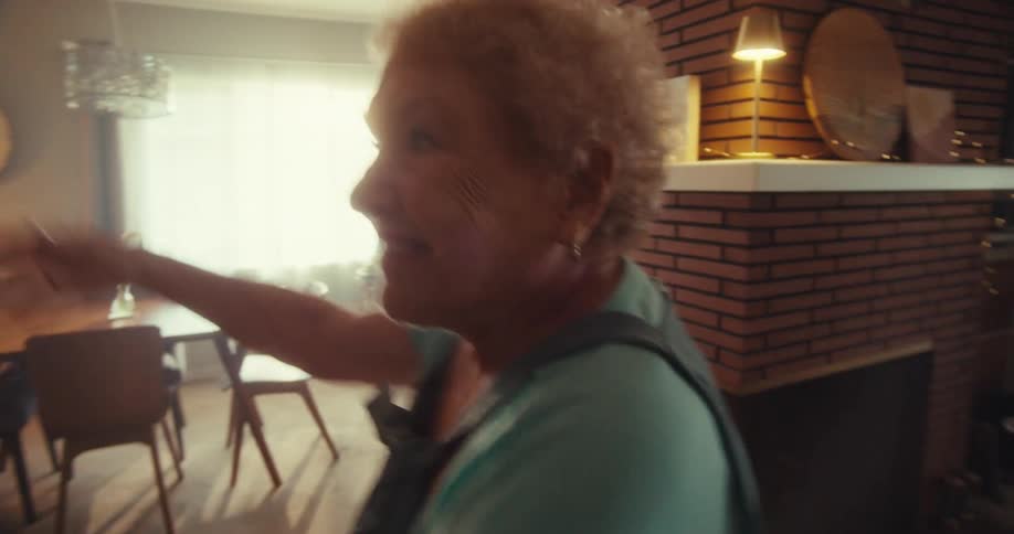 A woman spins and dances at home