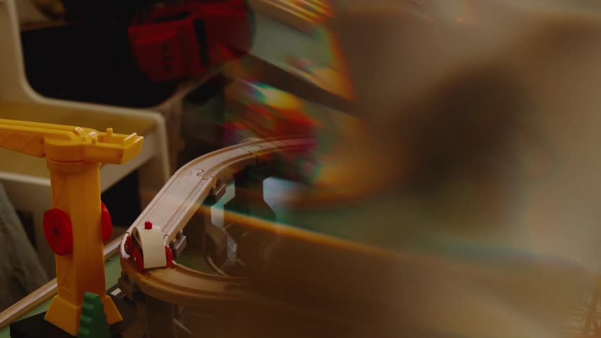 Tracks and toy cars are in the play area