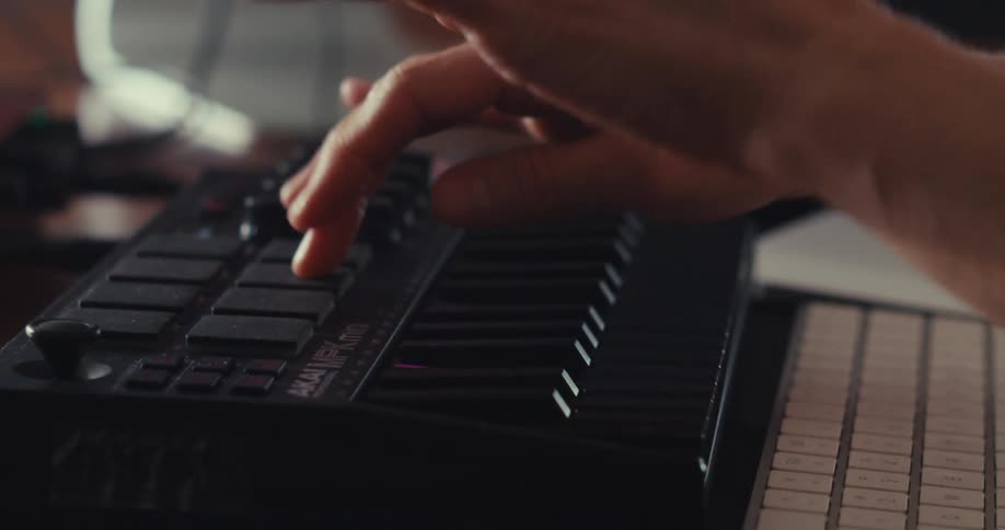 A person playing a musical keyboard