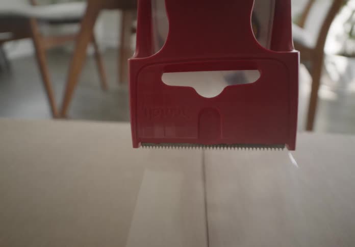 A cardboard box is taped shut
