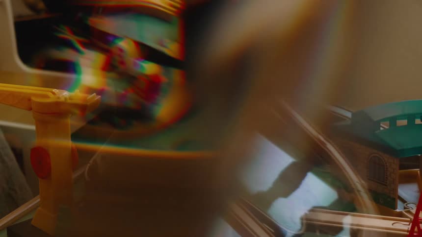 Reflective glass distorts and blurs rotating toy sets