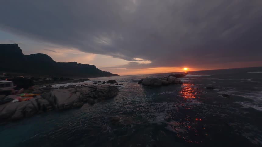 The sun is rising on the shore captured with a drone
