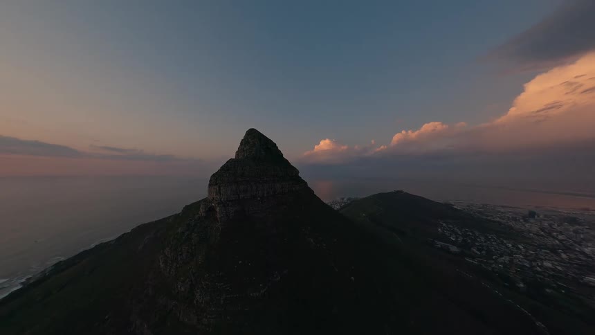Aerial of mountain peak at sunset