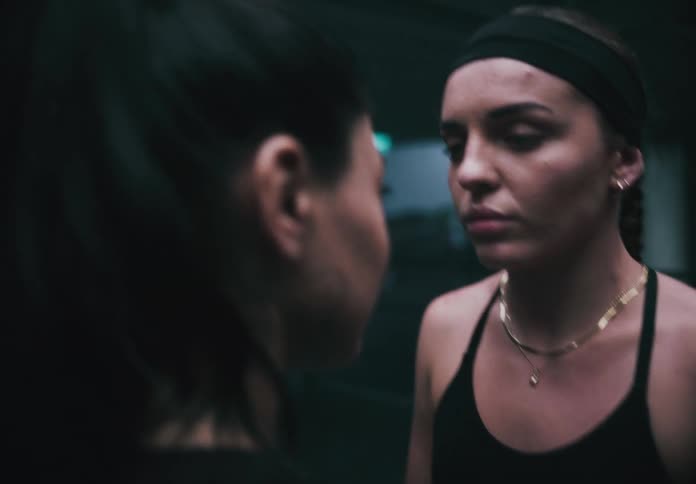 Two women face off in the boxing ring