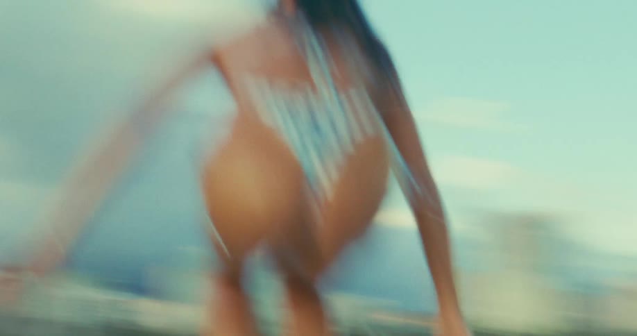 A woman is surfing in the ocean