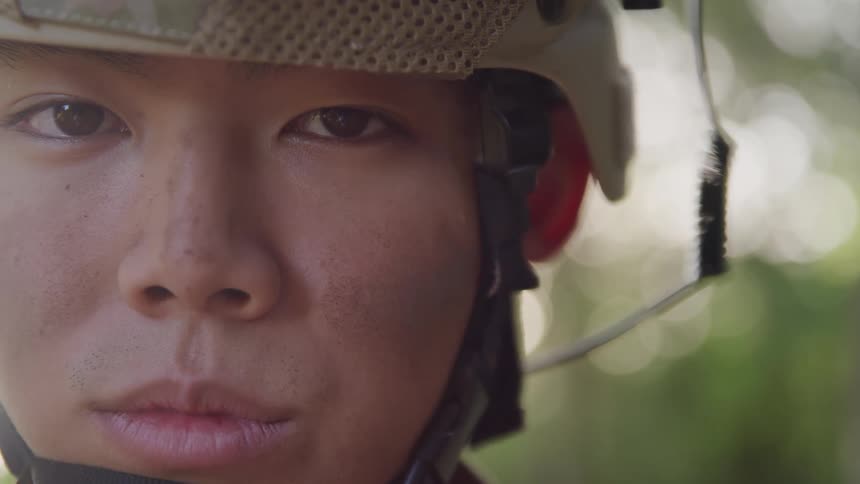 Portrait of an asian soldier wearing a helmet