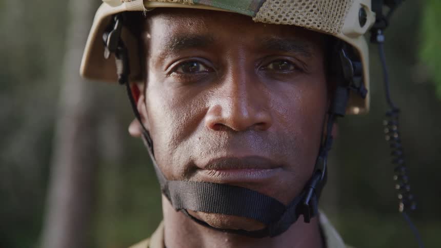 Portrait of a military man with a helmet