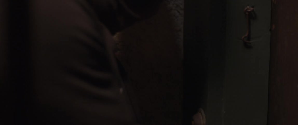 A person is working in a dark room