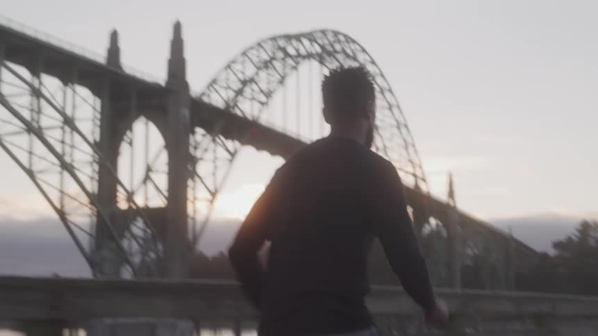 Man running outdoors at dawn