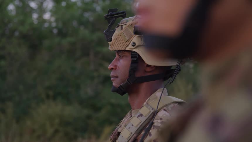 Military soldiers in direct position and concentrated outdoors