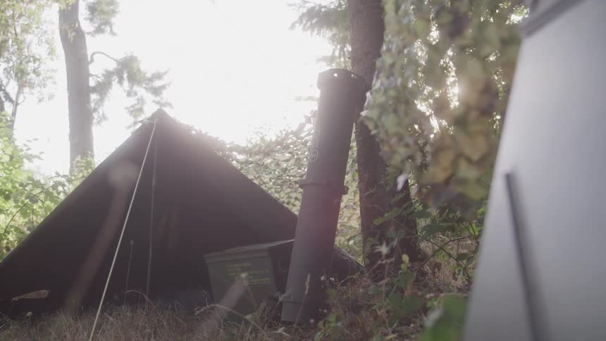 Makeshift tents at a military base in the forest