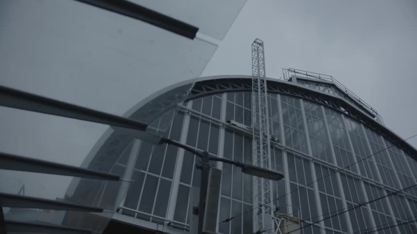 A tall building has an arch for a ceiling