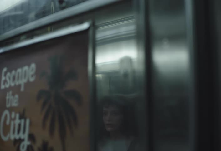 A woman sitting inside public transportation