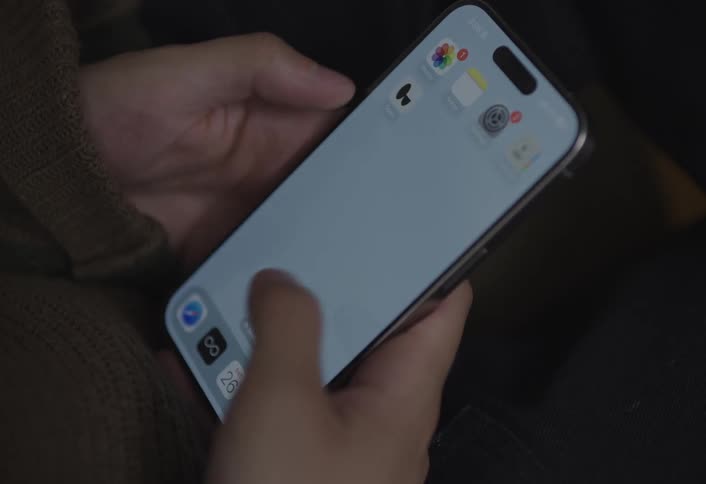 Pair of hands interacting with a smartphone