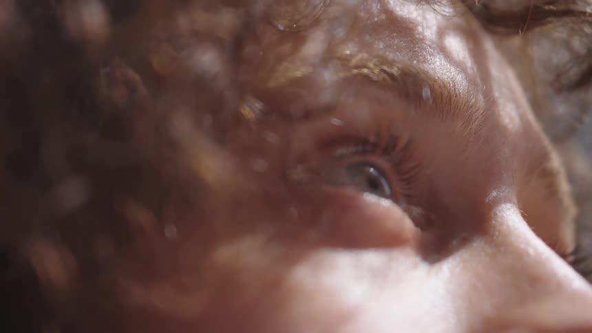 A person slowly blinks their eye