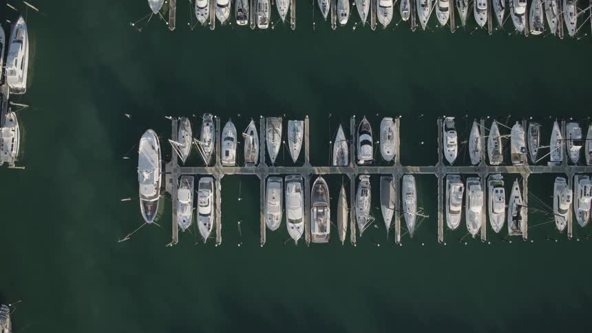 The boats are docked all along the harbor