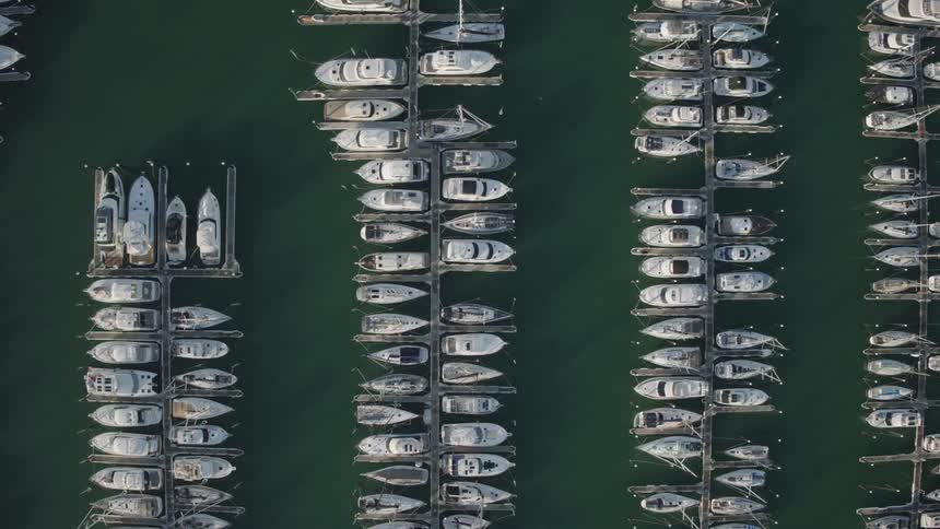 Many boats docked at several piers