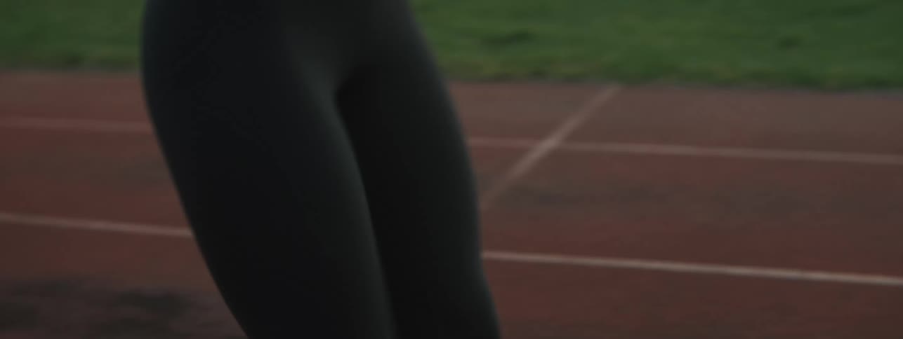 A woman is exercising on the track