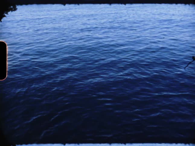 A body of water with calm sea waves