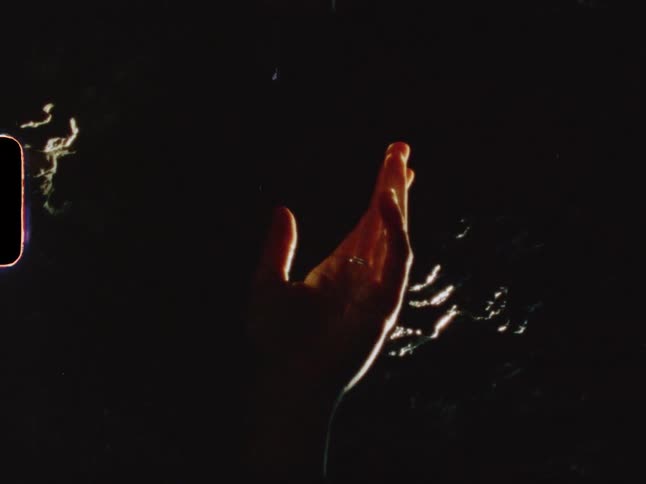 Close up of a hand with sun reflection
