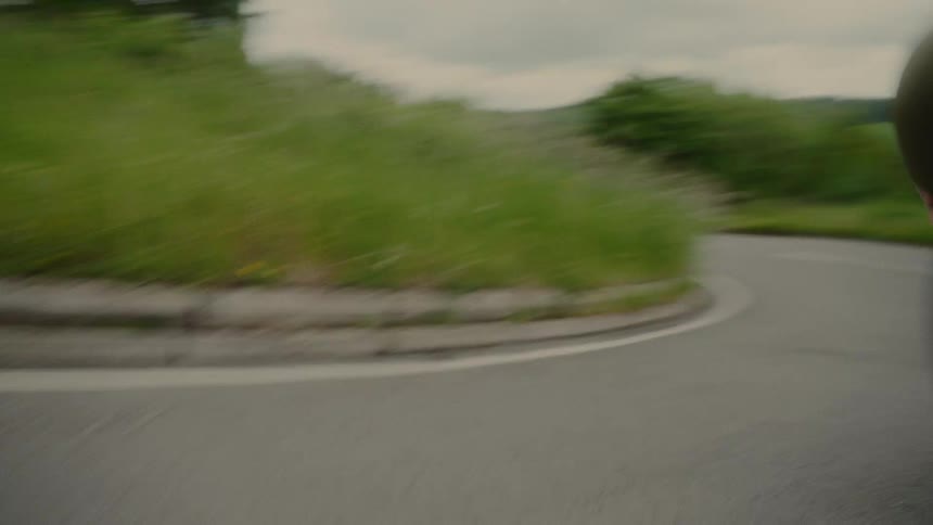 Cyclist making a turn on a road