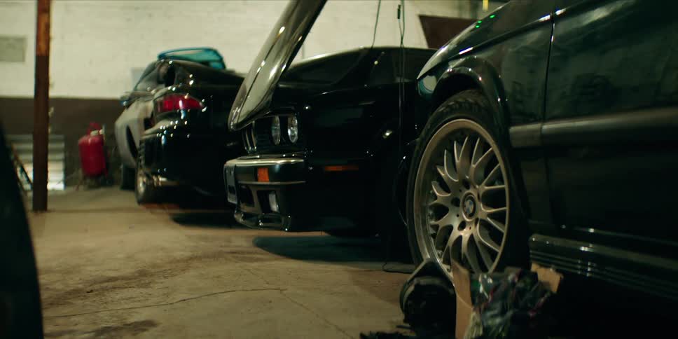 Some cars in a repair shop