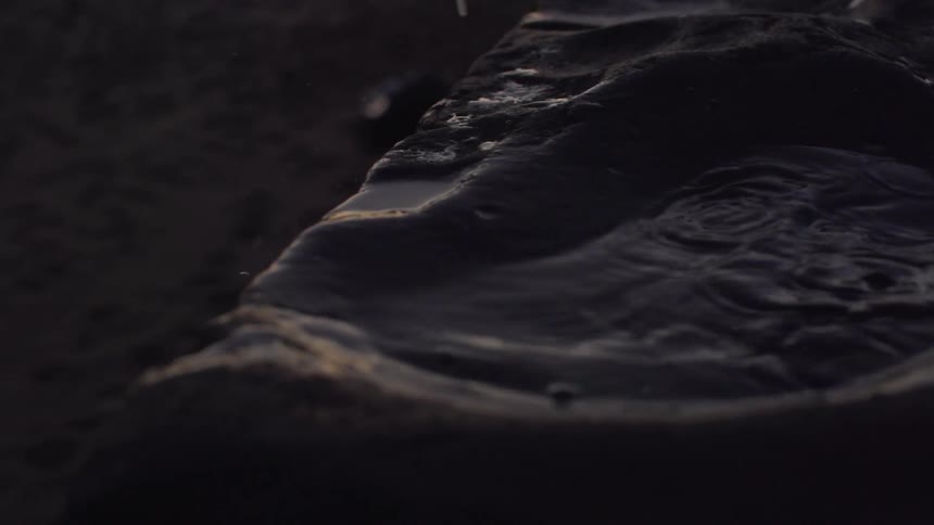 Hands splash in a pool of water