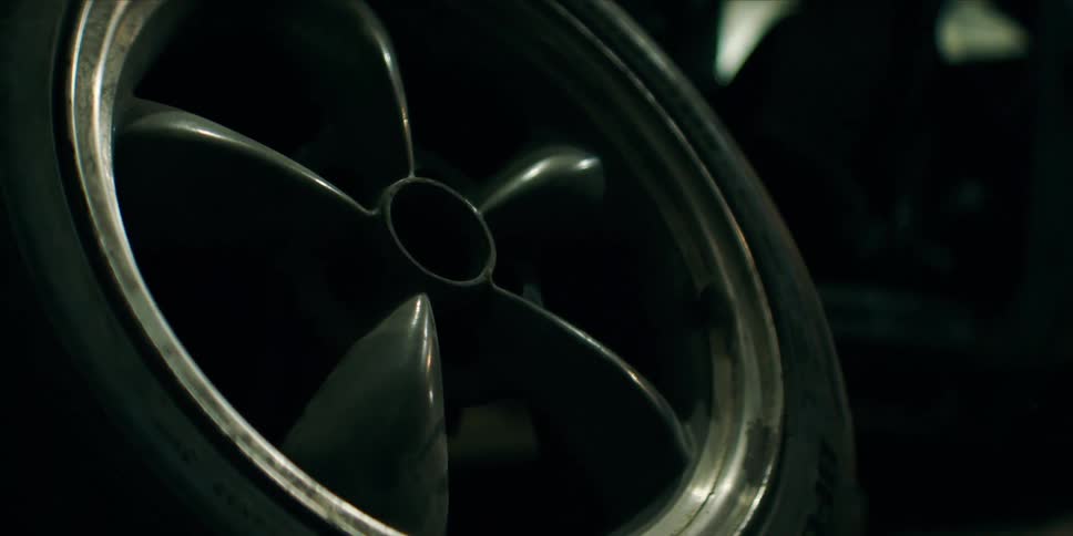 A wheel is sitting in the garage