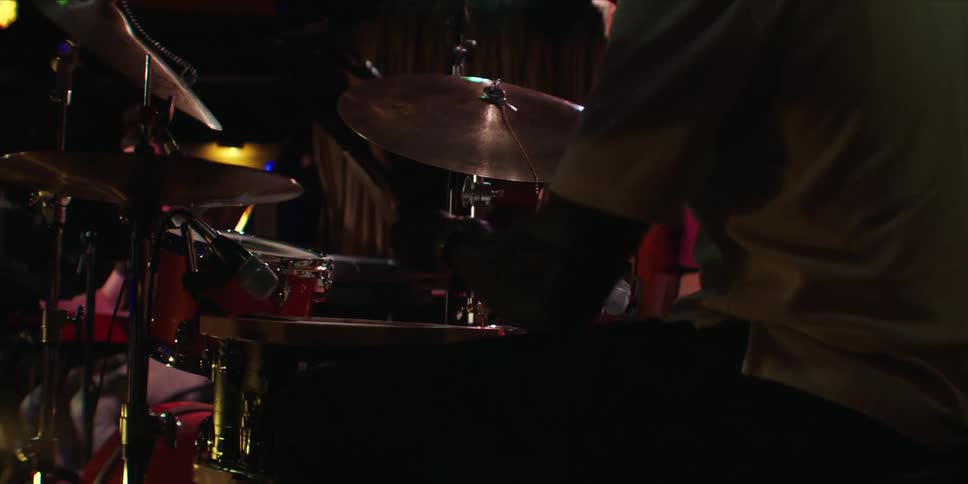 Band of musicians plays on stage during a performance
