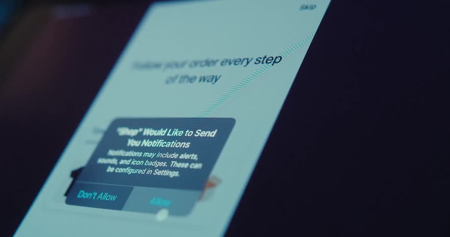 A closeup of a screen displaying a gray sweater from an online store