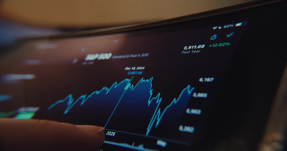 A mans finger drags across the screen of a tablet to get relevant data from a graph