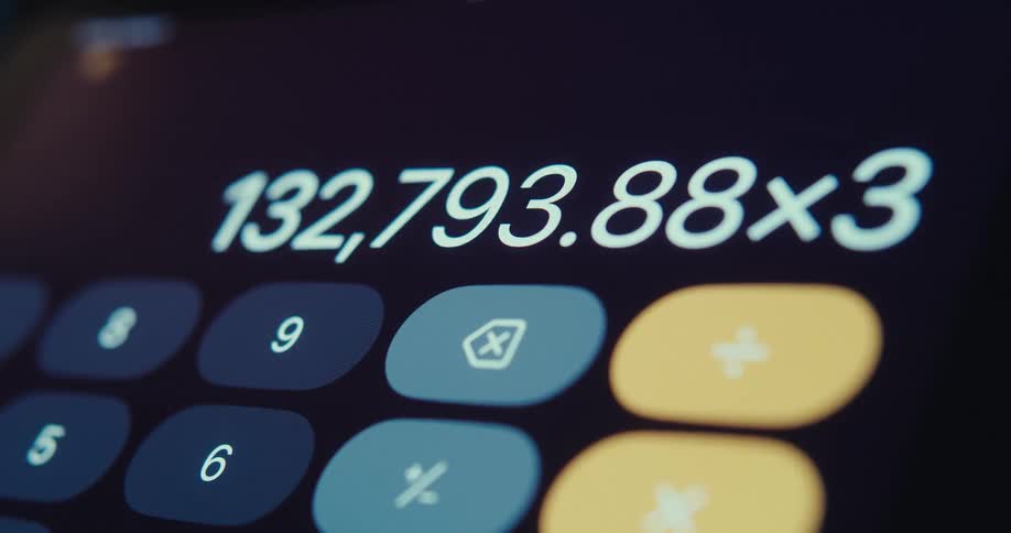 An iphone open to the calculator app actively performing calculations