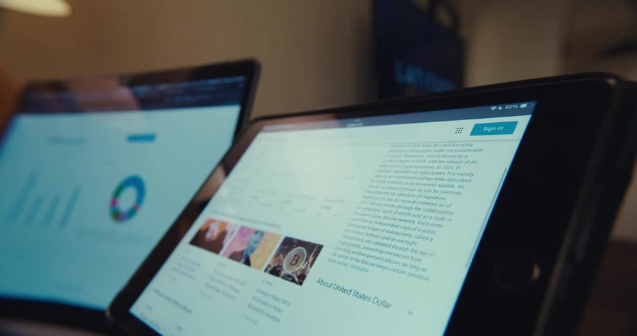 Closeup of financial data on screens in a business setting