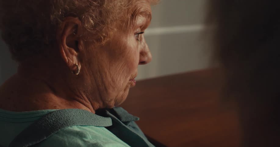 The face of a lady who is talking to someone who is on her right side and making facial expressions of surprise