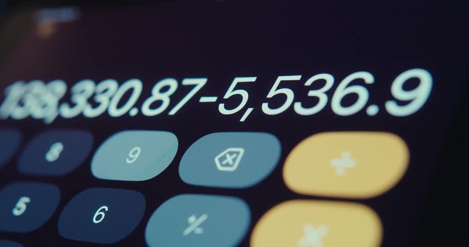 Close up of a device screen displaying a calculator application interface performing subtractions