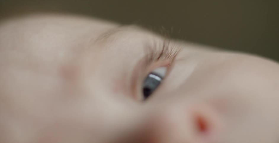 A blue eyed baby stares out