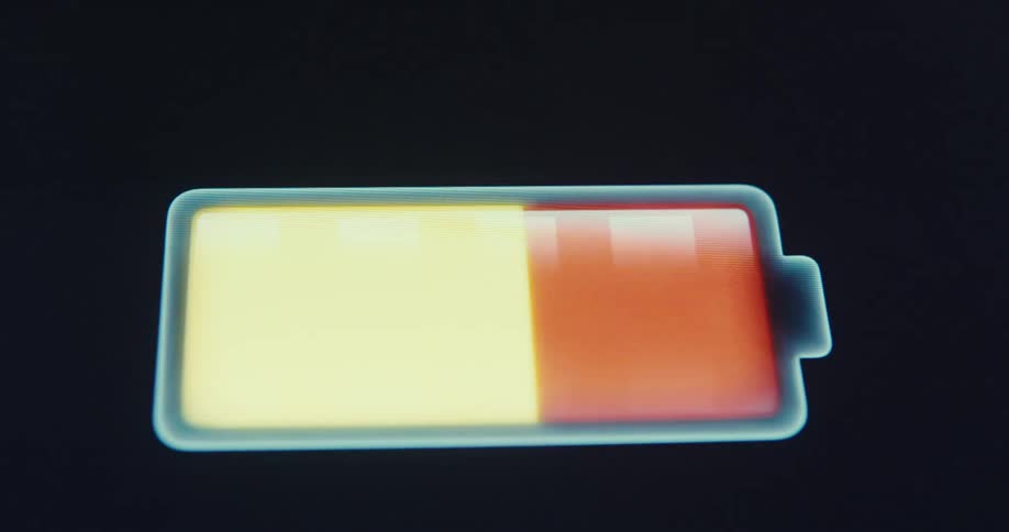 Digital display of a battery charging from red to green on a screen