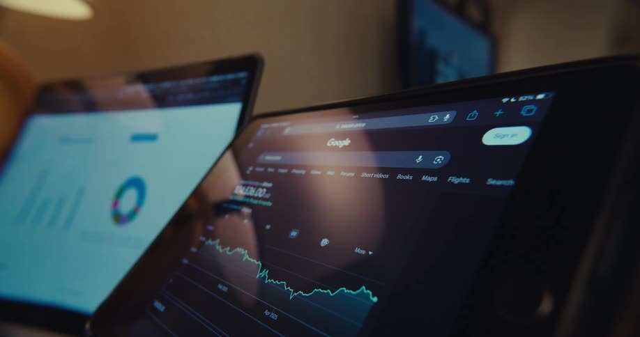 Two computer screens showing a graph with green lines