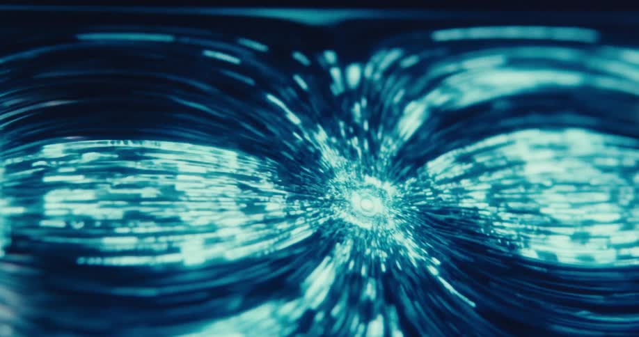 Streaks of blue and white light rush inward toward a central point creating a futuristic abstract visual of traveling through a digital tunnel