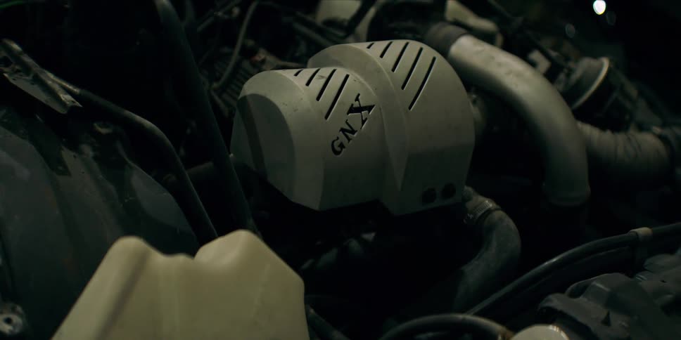 Close up of an open vehicle engine in a garage or workshop