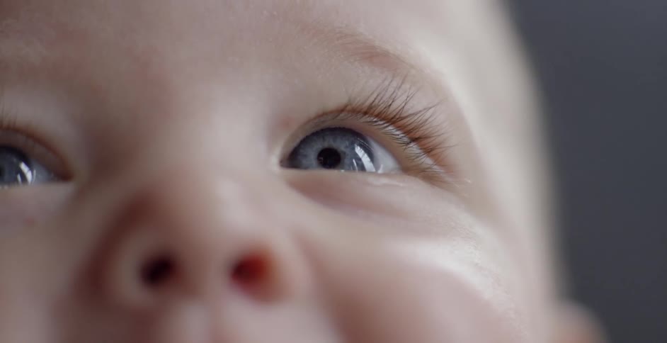 A blue eyed baby stares out