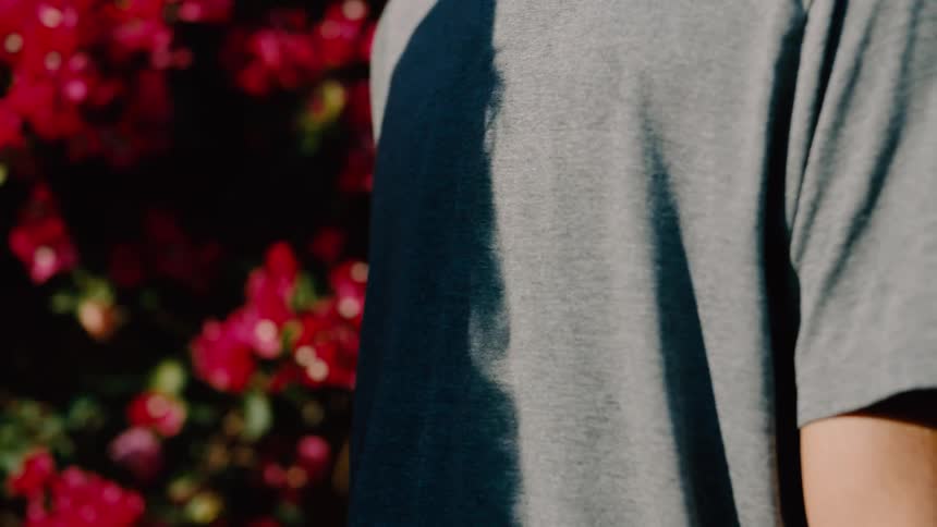 Close up of a woman stopping a man approaching her outdoors with her hands to his chest
