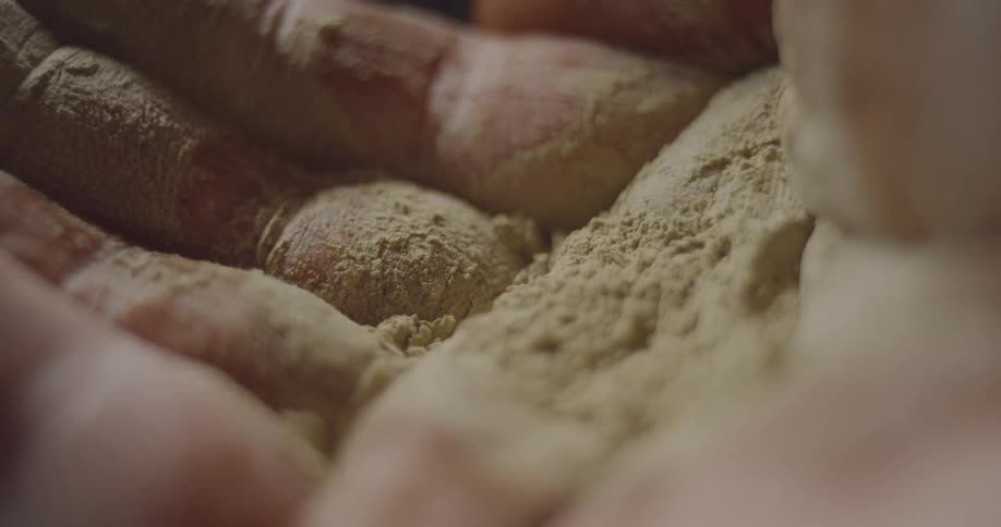 A person with sand in their hands